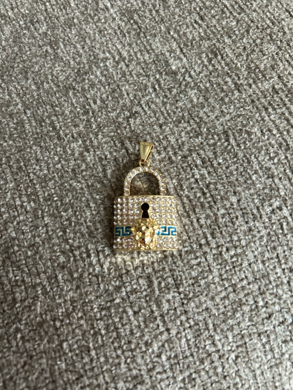 Gold Tone Pavé Padlock Pendant with Blue Accent and Medusa Motif